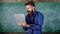 Annoyed by slow internet. Slowly internet annoying him. Teacher bearded man modern laptop chalkboard background. Hipster