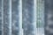 Anodized steel vertical bars with unfocused background