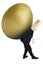 Anonymous businessman is carrying golden egg