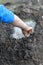 Anonymous child arms and hands playing with mud and water