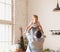 Anonymous father lifting cute son above head in kitchen