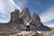 Anonymous female hiker in front of a beautiful mountain scenery.Three peaks. Dolomites. Italy