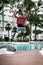 Anonymous guy jumping on poolside