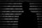 Anonymous hacker without face and binary code background