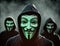 Anonymous hacking group, unknown men in black hoodie with hoods and white masks