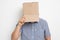 An anonymous man with a box on his head concealing his identity I