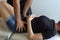 Anonymous osteopath working on hips of woman lying on stretcher
