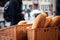 Anonymous person buying homemade bread at food market