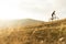 Anonymous sportsman on bicycle riding up hill