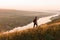 Anonymous traveler walking in countryside