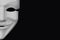 Anonymous white mask isolated on a black background