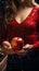 Anonymous woman measures weight, apple in her grasp, prioritizing health and fitness