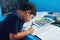 Another day to learn, another day to grow. an adorable little boy completing a school assignment at his desk.