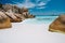 Anse Cocos, La Digue island, Seychelles. Tropical lagoon with granite boulders in the turquoise water and a pristine white sand