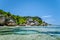 Anse Source d'Argent - Famous granite boulders on paradise tropical beach with shallow turquoise water. La Digue