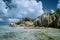 Anse Source d`Argent - most famous paradise tropical beach. Bizarre granite rocks against beautiful white clouds. La
