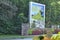 Ansley Park sign with Atlanta Botanical Garden flowers and greenery plants