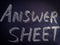 answer sheet word displayed on chalkboard for exam purpose