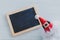Anta claus hat and empty blackboard with copyspace to add your t