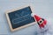 Anta claus hat and empty blackboard with Sales text design