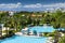 ANTALYA, TURKEY - APRIL 13, 2016: Territory of IC Hotels Green Palace with swimming pool, palm trees and pines.