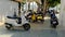 Antalya turkey - CIRCA 2021: Mopeds of different colors are parked on street in alley. Standing scooters on street in