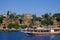 ANTALYA, TURKEY - JULY 0â€­4â€¬ 2019: View on the HÄ±dÄ±rlÄ±k Tower and a touristic boat in Antalya