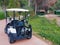 Antalya, Turkey, November 2019: a Golf Car with a bag of golf clubs on the track among the golf courses