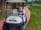 Antalya, Turkey, November 2019: a Golf Car with a bag of golf clubs on the track among the golf courses
