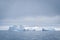 Antarctic glacier in the snow. Beautiful winter background.