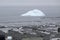 Antarctic iceberg shot from the shore on a cloudy day