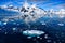 Antarctic landscape with snow on mountains reflecting in blue water, ice flows, Lemaire Channel near Paradise Bay, Antarctica