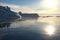 Antarctic landscape with snowy mountains, glaciers and icebergs. Landscape of icy shores in Antarctica. Beautiful blue