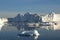 Antarctic landscape with snowy mountains, glaciers and icebergs. Landscape of icy shores in Antarctica. Beautiful blue