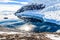 Antarctic mountain landscape with cruise ship standing still on