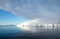 Antarctic ocean, Antarctica. Glacier Snow Covered Mountain. Dramatic blue Sky