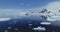 Antarctic seascape at glacier coast aerial. Icebergs floating at arctic ocean bay. Melting ice, snow