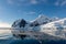 Antarctic seascape with iceberg and reflection