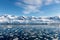 Antarctic seascape with icebergs and reflection