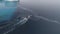 Antarctica aerial flight over fast moving boat.