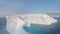 Antarctica big iceberg float aerial tracking view