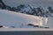 Antarctica calm pink midnight sunset over glaciers