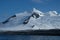 Antarctica hiking beneath pristine mountains, snow and creeping glaciers