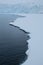 Antarctica jagged white sea ice hovering over ocean