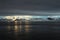 Antarctica landscape, icebergs, mountains and ocean at sunrise