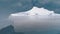 Antarctica shot through iceberg arch.