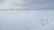 Antarctica snow covered surface aerial timelapse