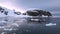 Antarctica. Snowy mountains and icebergs. Cruise Travel to the Edge of the Earth. Amazing beautiful views of Nature and