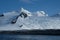 Antarctica solo hiking beneath pristine mountains, snow and glaciers