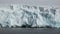 Antarkeic landscape with snowy mountains, glaciers and icebergs. Landscape of icy shores in Antarctica. Beautiful blue